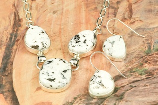 Genuine White Buffalo Turquoise set in Sterling Silver. Beautiful Necklace and Earrings Set.  This Beautiful Stone is formed from the minerals Calcite and Iron. It is mined near Tonopah Nevada.  Created by Navajo Artist Tony Garcia. Signed by the artist. 